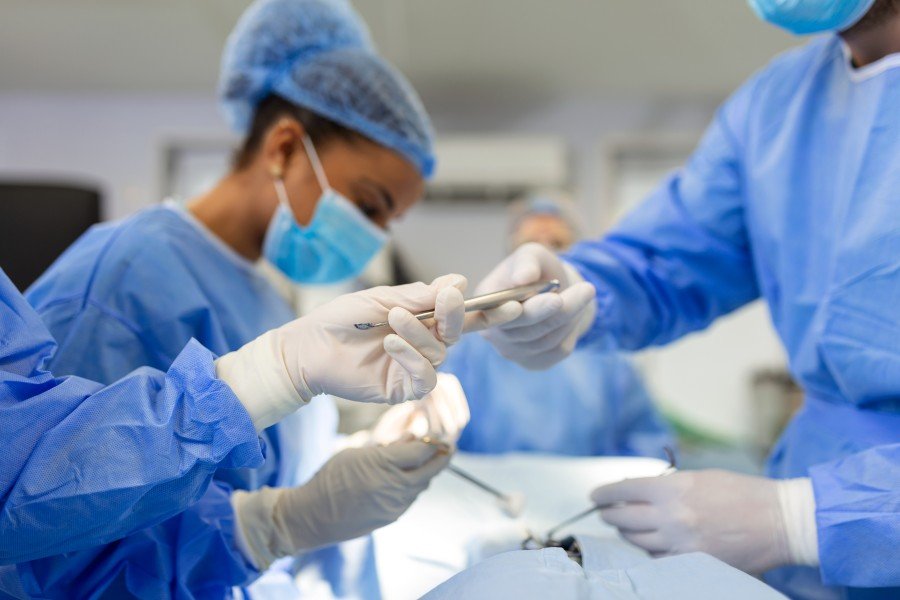 Laparoscopic gynaecological surgeons performing a surgical procedure in an operating room