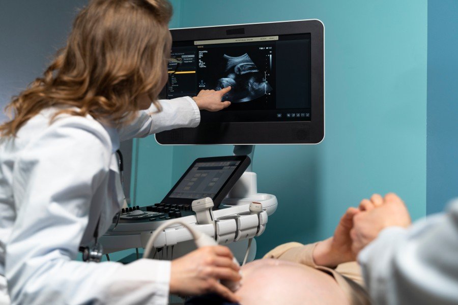 Gynecologist performing an ultrasound examination during pregnancy